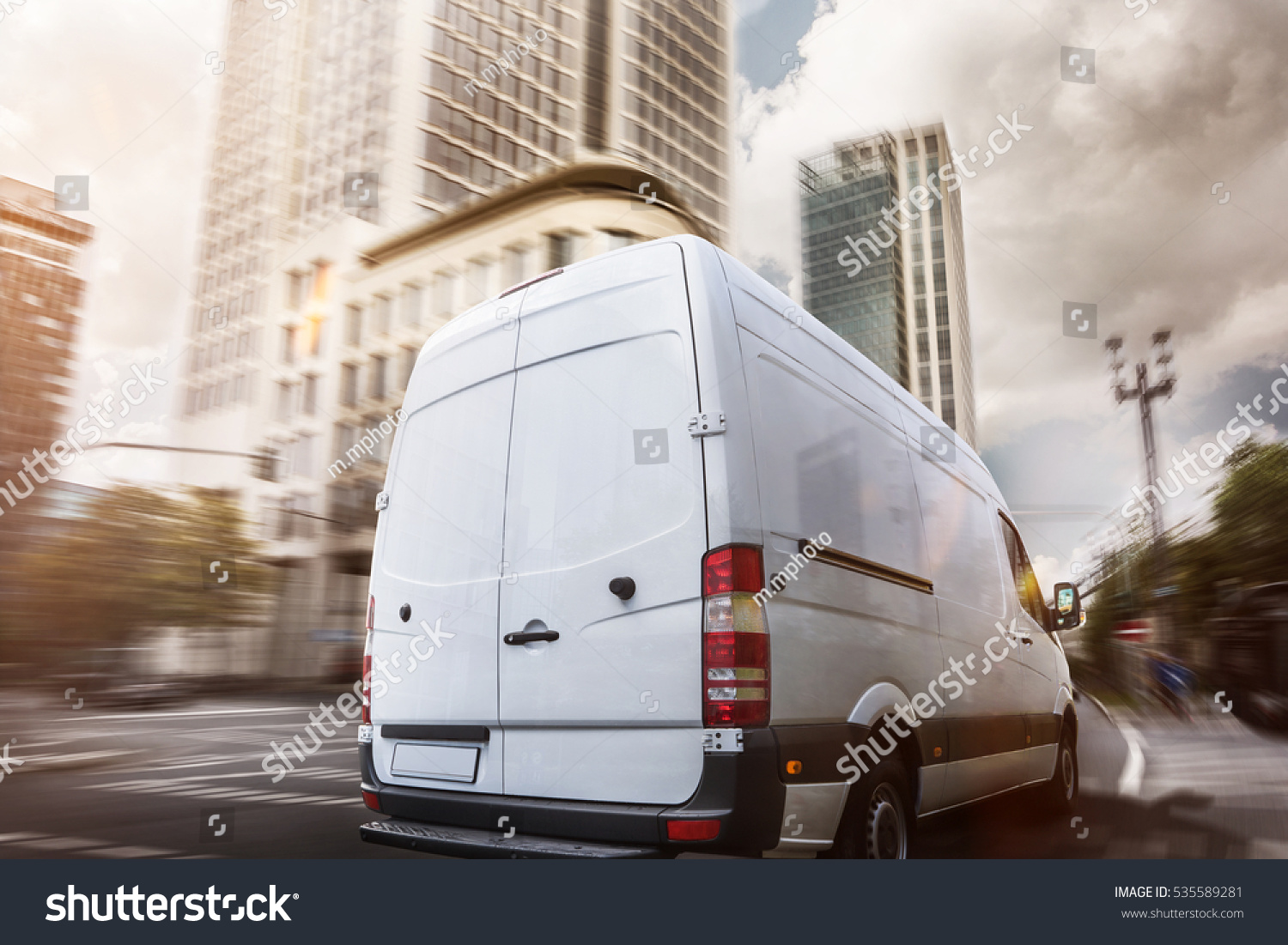 stock-photo-delivery-truck-in-a-city-535589281.jpg